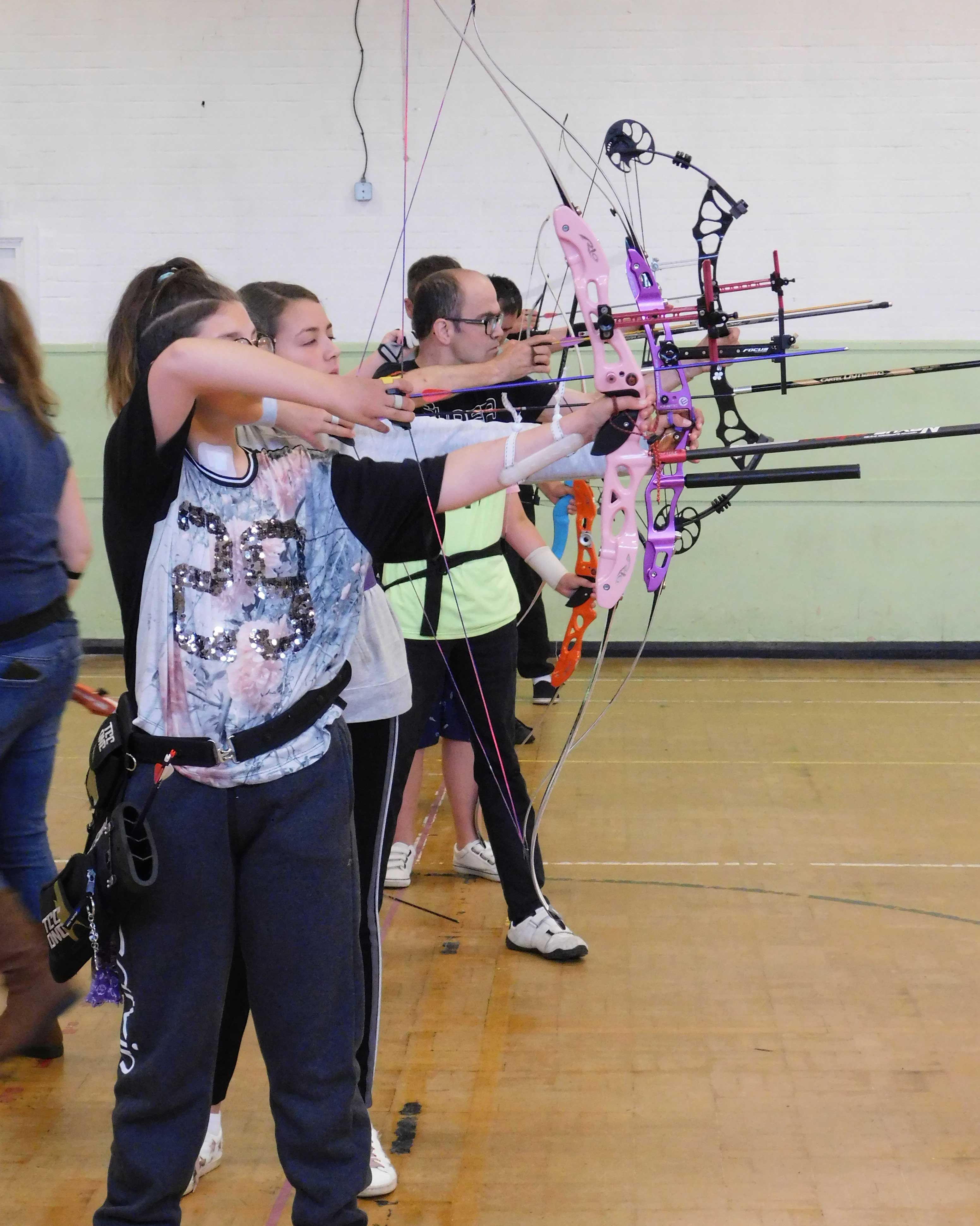 Bows raised on shooting line