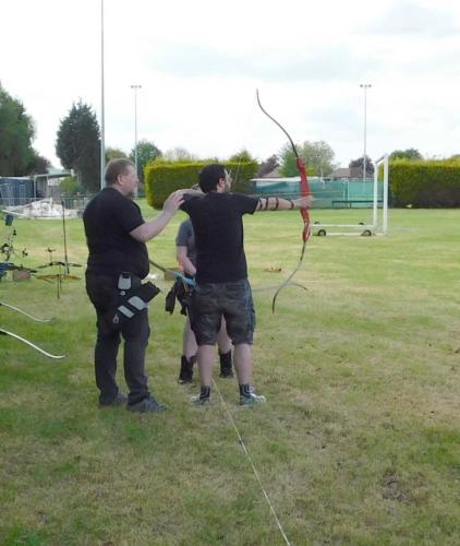 Coaching a new member on the shooting line